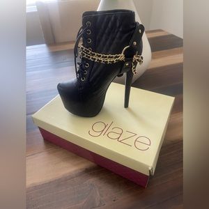 Black extra high ankle boots